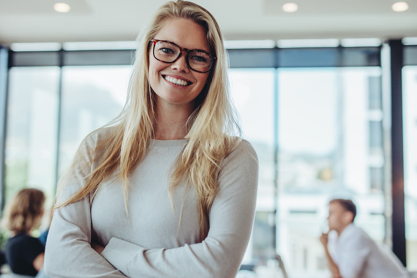 Portrait,Of,Confident,Businesswoman,With,Colleagues,In,Boardroom.,Positive,Woman