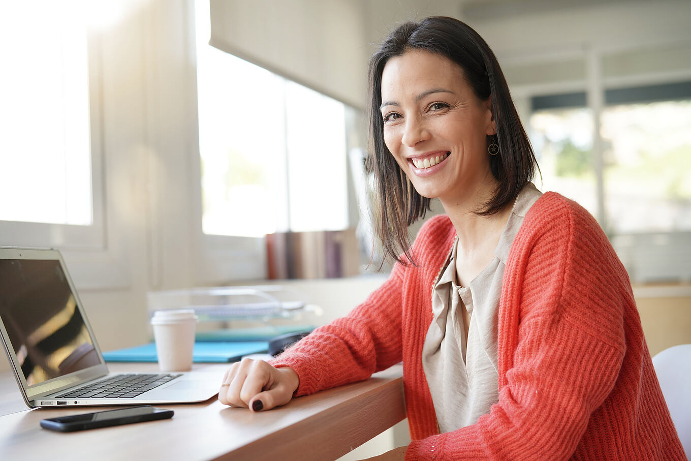 Smiling,Brunette,Woman,In,Front,Of,Laptop