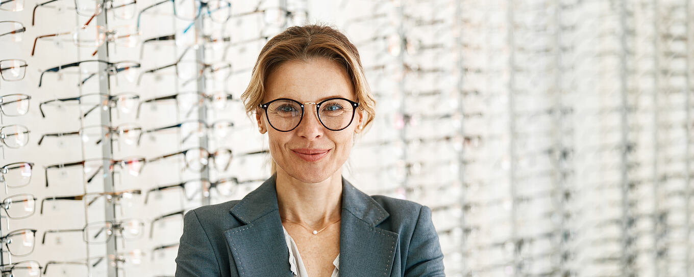 Portrait,Of,Middle-aged,Woman,Wearing,Glasses,In,Optical,Store