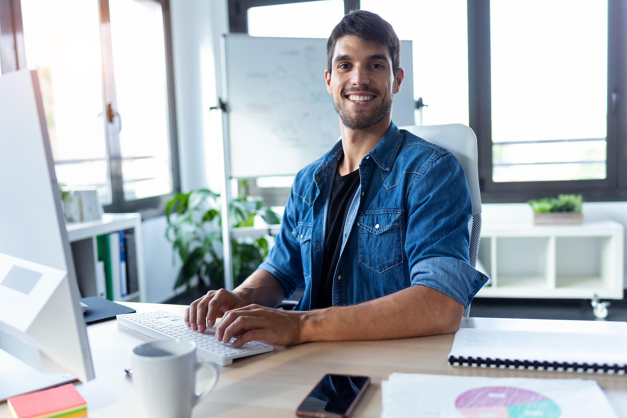 Shot,Of,Software,Developer,Looking,At,Camera,While,Working,With